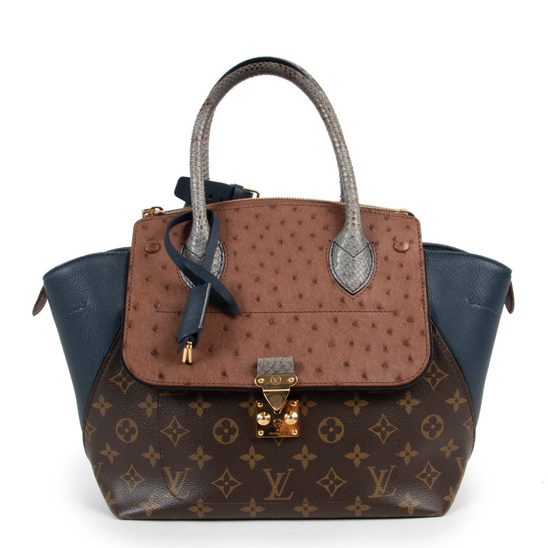 Buy an authentic second hand Louis Vuitton Majestueux Blue Python Ostrich Monogram Top Handle in very good condition at Labellov.