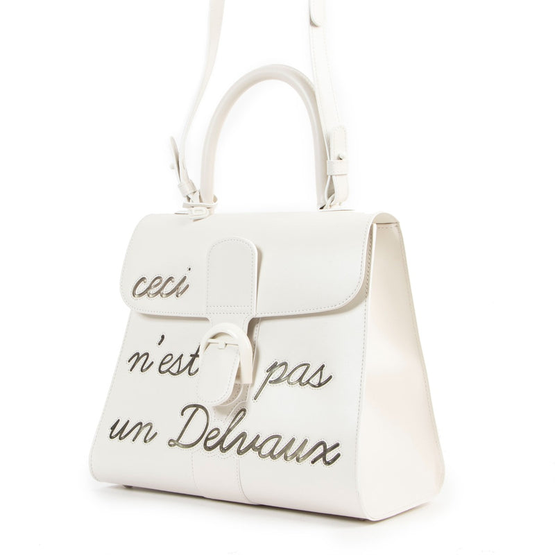 Buy online an authentic second hand Delvaux Brillant MM L'Humour ( Ceci n'est pas un Delvaux) Limited Edition in very good condition at Labellov in Antwerp.