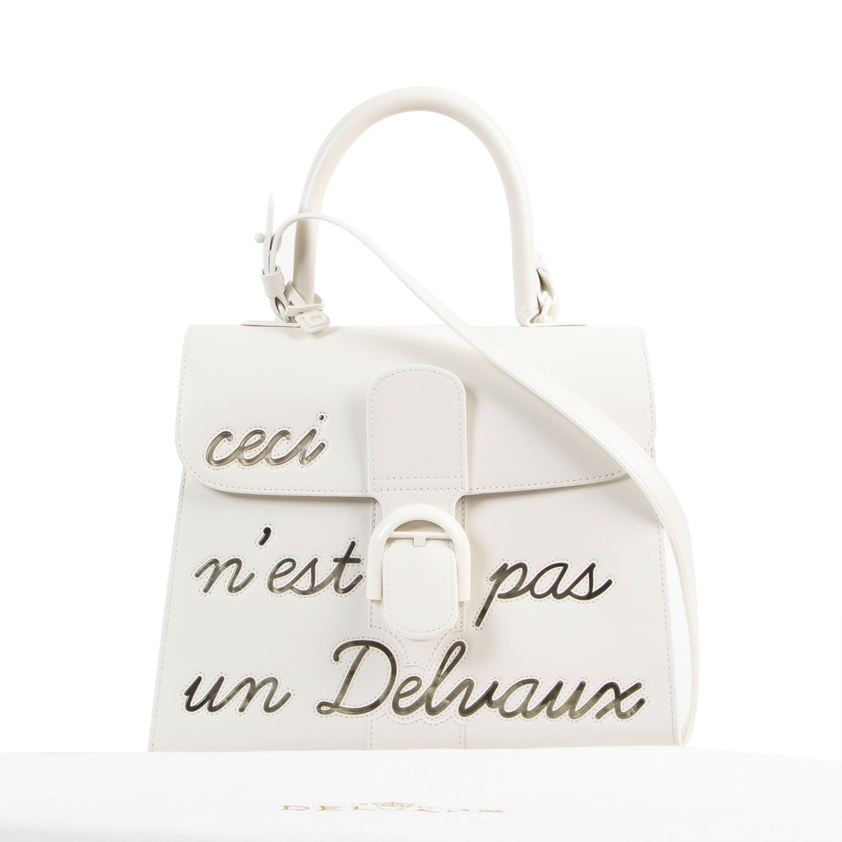Buy online an authentic second hand Delvaux Brillant MM L'Humour ( Ceci n'est pas un Delvaux) Limited Edition in very good condition at Labellov in Antwerp.