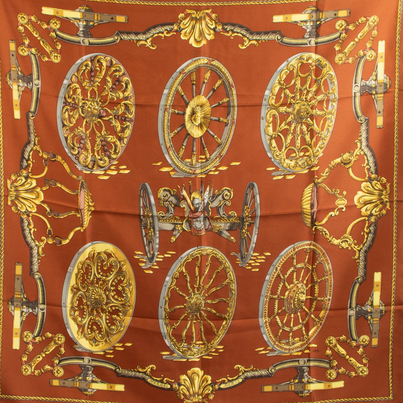 Shop safe online at Labellov in Antwerp, Brussels and Knokke this 100% authentic second hand Hermès Brown and Gold 'Roues De Canon' Carré 90 Silk Scarf