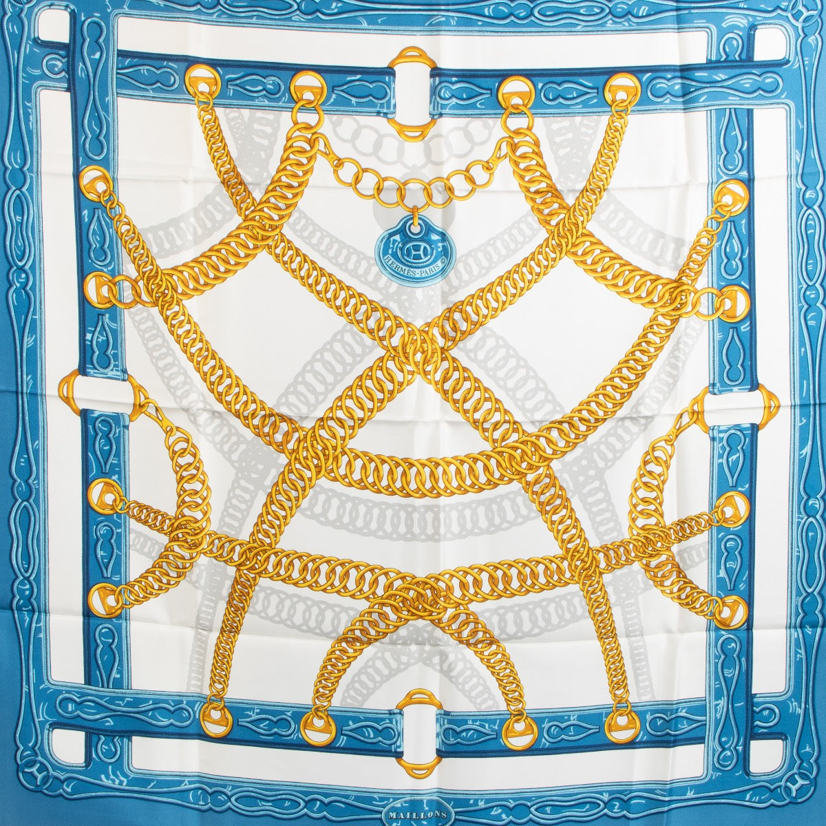 Shop safe online at Labellov in Antwerp, Brussels and Knokke this 100% authentic second hand Hermès Light Blue Maillons Silk Scarf