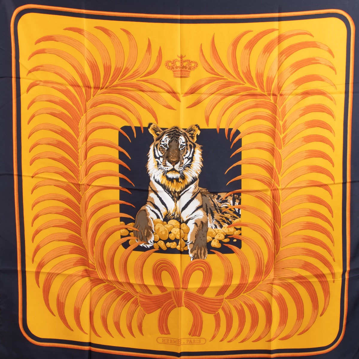 Shop safe online at Labellov in Antwerp, Brussels and Knokke this 100% authentic second hand Hermès Orange and Navy Blue Tiger Royal Silk Scarf