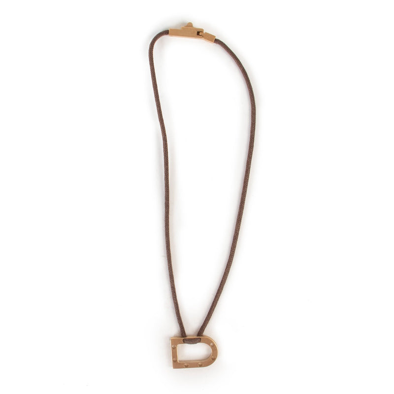 Shop authentic second hand vintage luxury designer fashion Delvaux Pale Gold D Pendant Necklace at Labellov