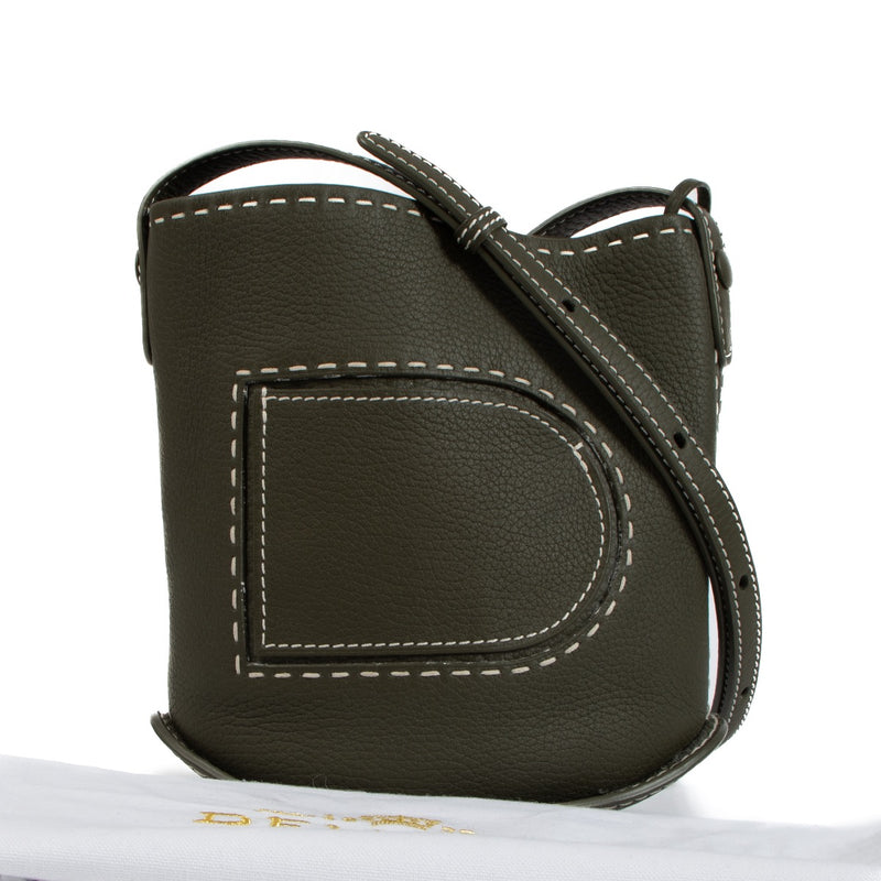 Shop safe online at Labellov in Antwerp, Brussels and Knokke this 100% authentic second hand Delvaux Kaki Taurillon Soft Pin Mini Bucket Surpiqué