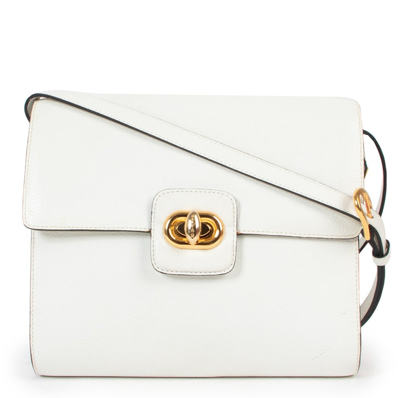 Shop vintage Delvaux White Turnlock Crossbody Bag at Labellov