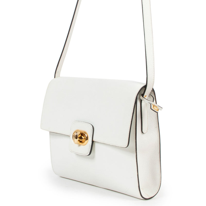 Shop vintage Delvaux White Turnlock Crossbody Bag at Labellov