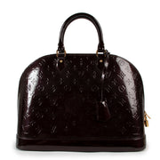 Buy online an authentic second hand Louis Vuitton Alma GM Monogram Vernis top handle in good condition at Labellov in Antwerp.