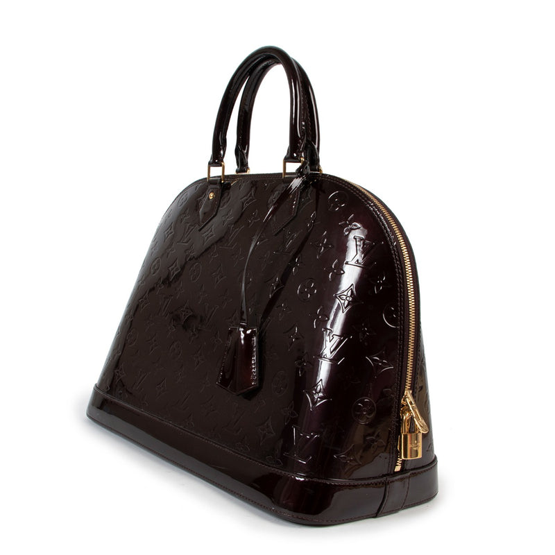 Buy online an authentic second hand Louis Vuitton Alma GM Monogram Vernis top handle in good condition at Labellov in Antwerp.