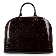 Buy online an authentic second hand Louis Vuitton Alma GM Monogram Vernis top handle in good condition at Labellov in Antwerp.