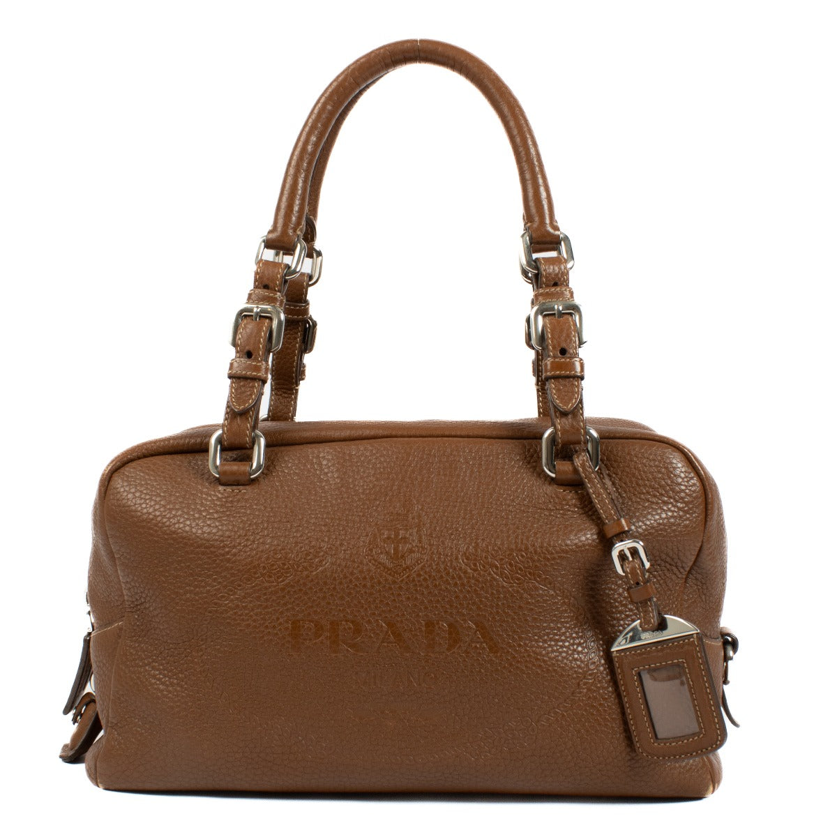 Prada Brown Vitello Daino Bauletto Bag crafted from textured Vitello Daino leather, featuring a sleek structured design, gold-tone hardware, and spacious interior.Shop now on Labellov.com.