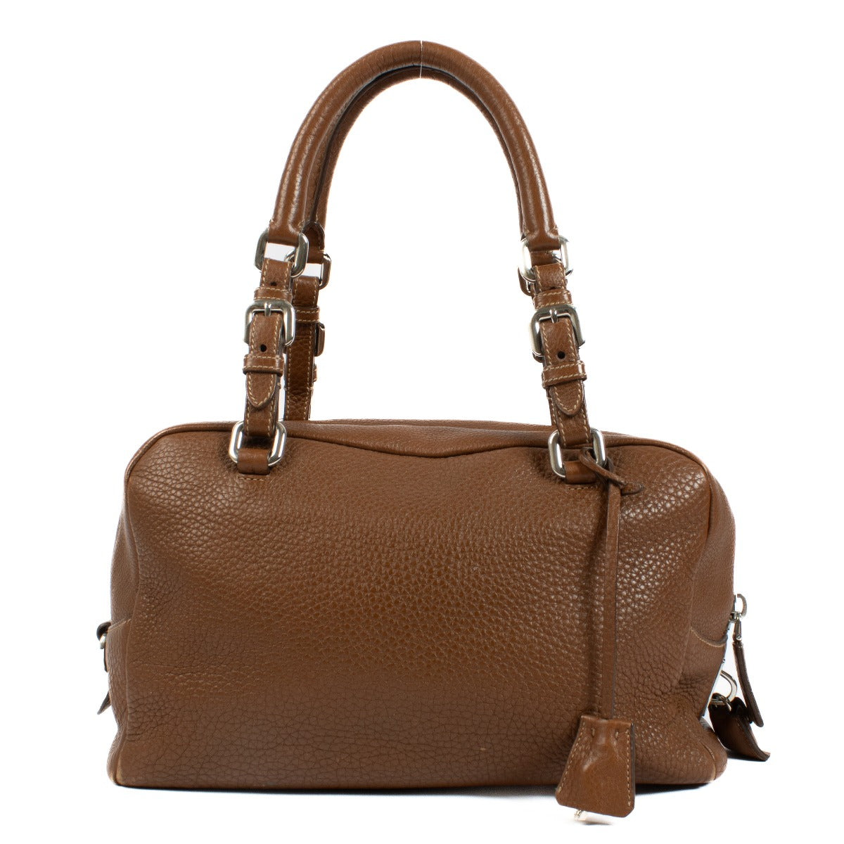 Prada Brown Vitello Daino Bauletto Bag crafted from textured Vitello Daino leather, featuring a sleek structured design, gold-tone hardware, and spacious interior.Shop now on Labellov.com.