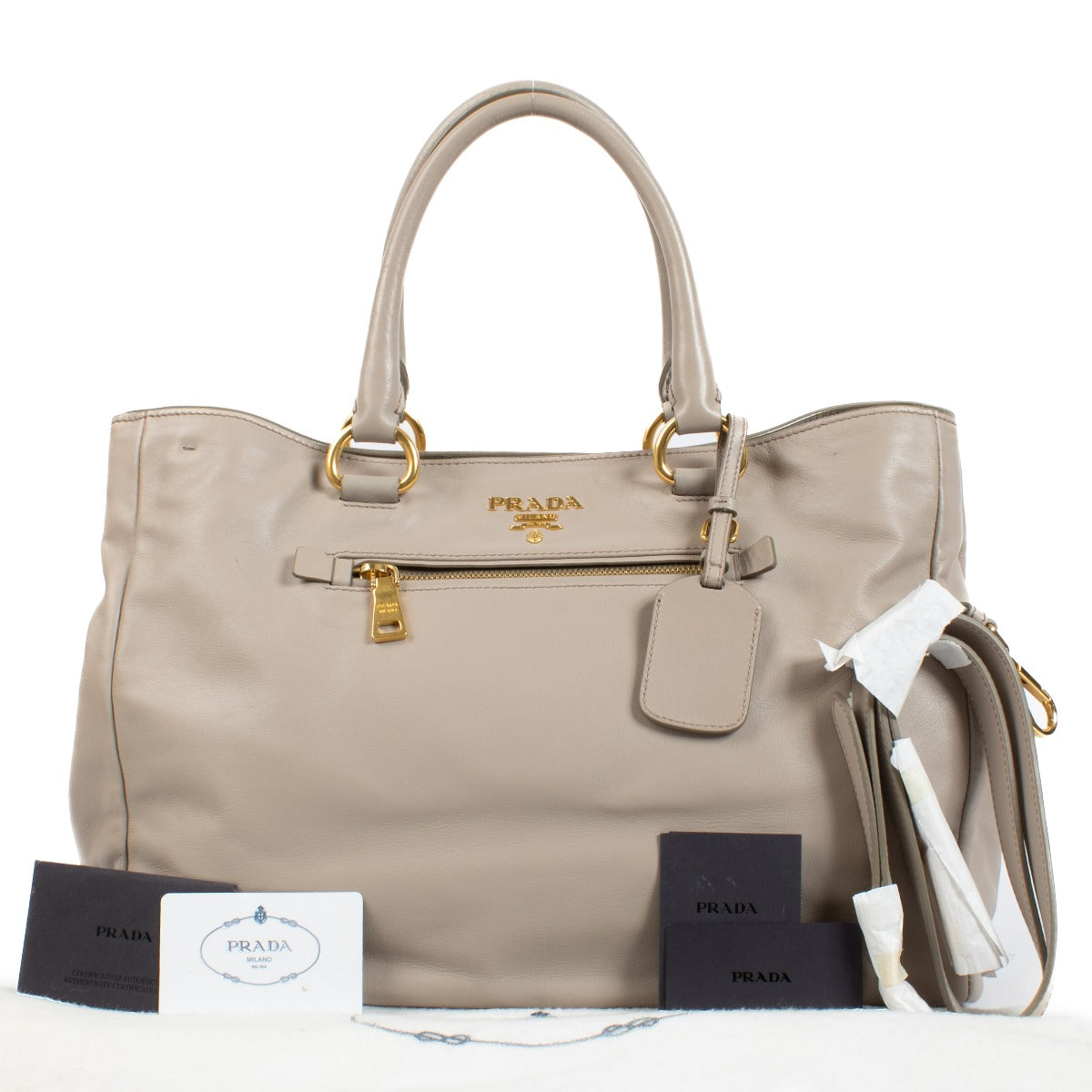Prada Pomice Soft Calf Tote Bag in light grey soft calf leather with dual top handles, structured design, and spacious interior for everyday use. Shop now on Labellov.com.