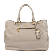 Prada Pomice Soft Calf Tote Bag in light grey soft calf leather with dual top handles, structured design, and spacious interior for everyday use. Shop now on Labellov.com.