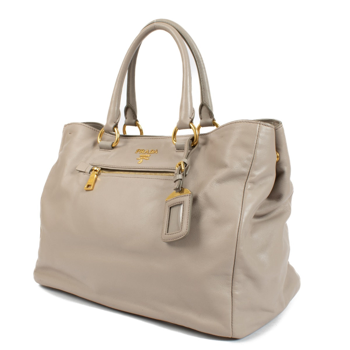 Prada Pomice Soft Calf Tote Bag in light grey soft calf leather with dual top handles, structured design, and spacious interior for everyday use. Shop now on Labellov.com.