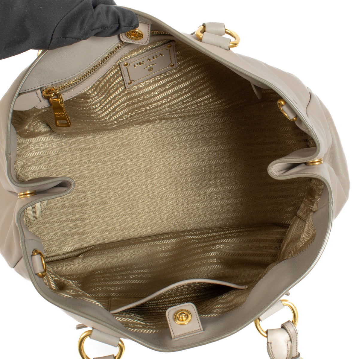 Prada Pomice Soft Calf Tote Bag in light grey soft calf leather with dual top handles, structured design, and spacious interior for everyday use. Shop now on Labellov.com.