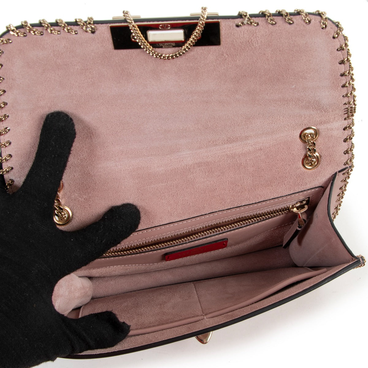 Buy online an authentic second hand Valentino Garavani Pink Rockstud Demilune Whipstitch Crossbody in good condition at Labellov in Antwerp.