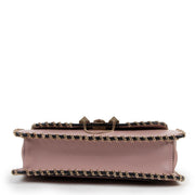 Buy online an authentic second hand Valentino Garavani Pink Rockstud Demilune Whipstitch Crossbody in good condition at Labellov in Antwerp.