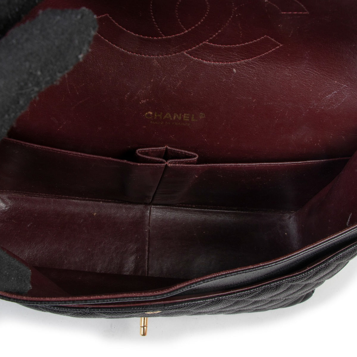 Buy an authentic second hand Chanel Black Caviar Maxi Classic Double Flap Bag as new at Labellov.