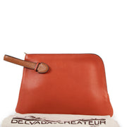 Buy online an authentic second hand Delvaux Red/Orange leather Clutch in very good condition at Labellov in Antwerp.