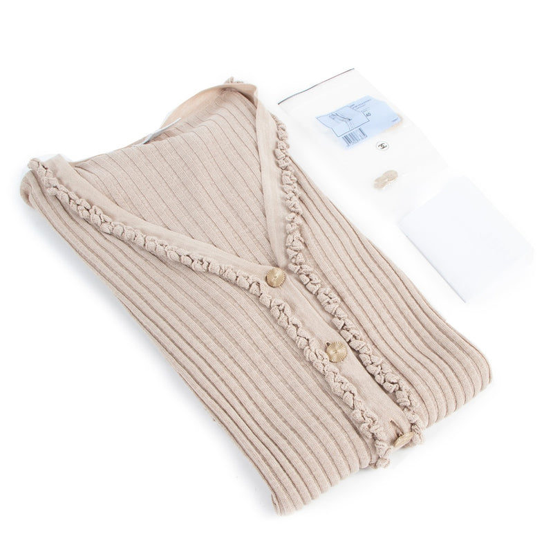 Buy online an authentic second hand Chanel Spring 2009 Beige Cardigan Dress in very good condition at Labellov in Antwerp.