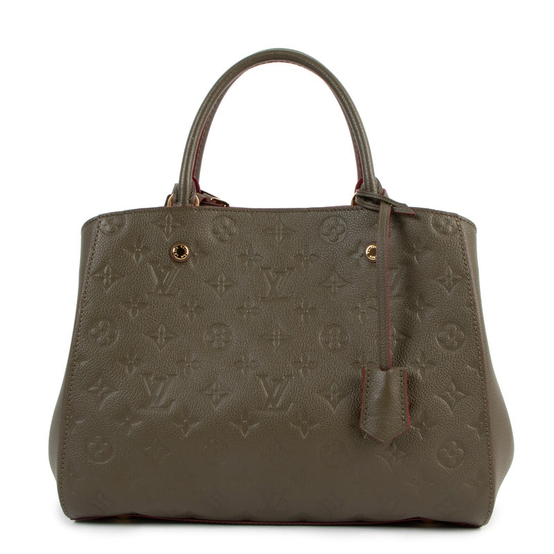 Buy online an authentic second hand Louis Vuitton Khaki Montaigne MM Monogram Empreinte in very good condition at Labellov in Antwerpen.
