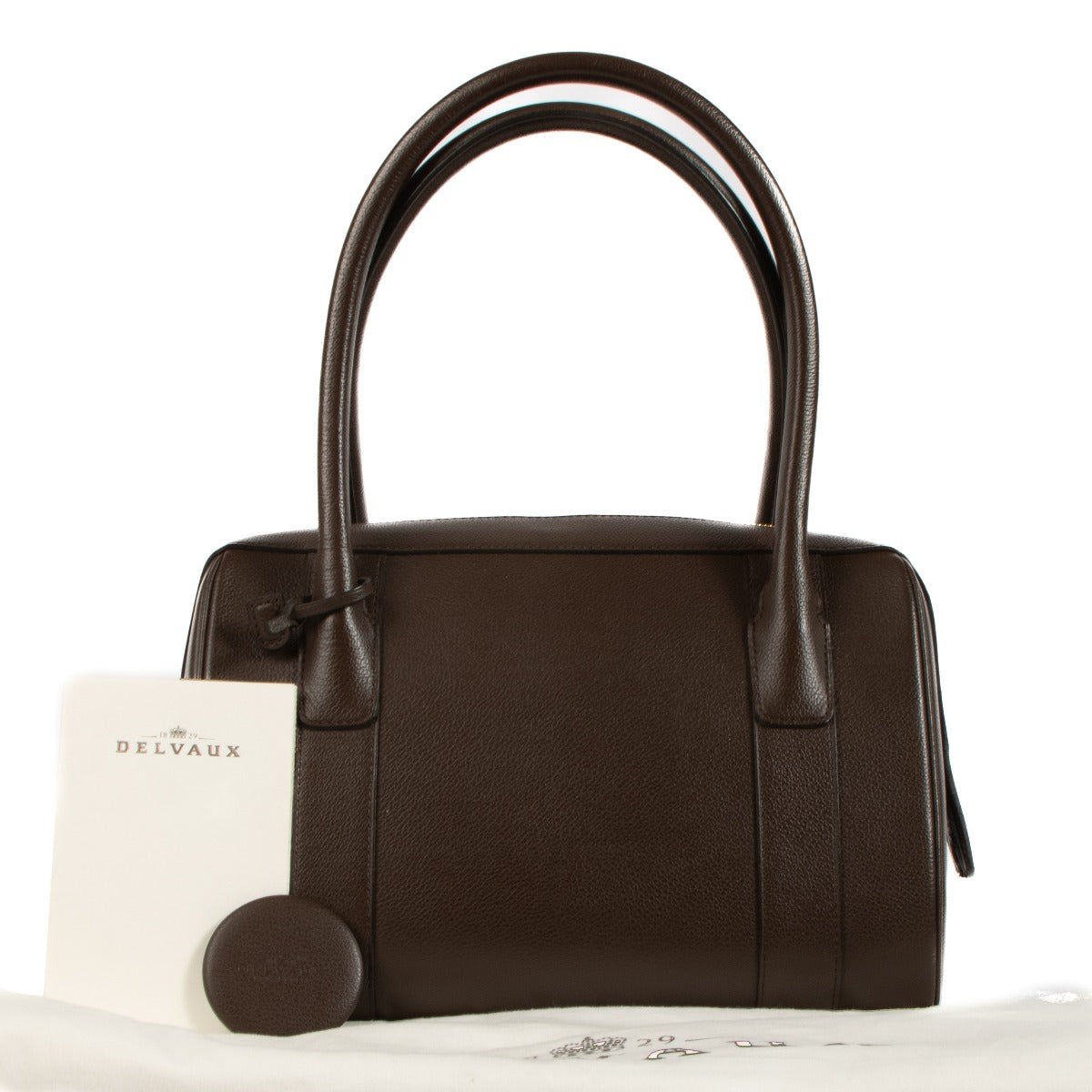 Shop safe online at Labellov in Antwerp, Brussels and Knokke this 100% authentic second hand Delvaux Chocolat Jumping Paola Top Handle Bag