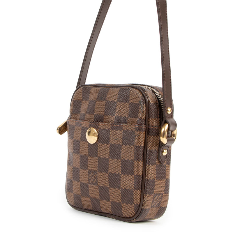 Buy online an authentic second hand Louis Vuitton Damier Ebene Rift Crossbody in very good condition at labellov in Antwerp.