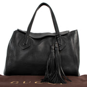 Buy online an authentic second hand Gucci Black Lady Tassel Pebbled Leather Top Handle in very good condition at Labellov in Antwerp.