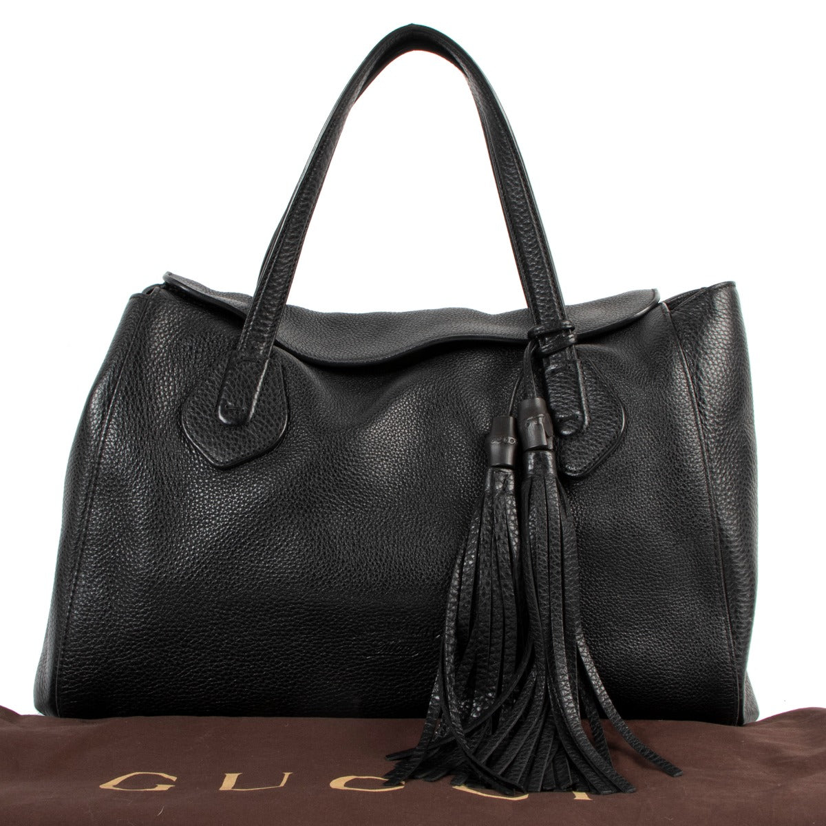 Buy online an authentic second hand Gucci Black Lady Tassel Pebbled Leather Top Handle in very good condition at Labellov in Antwerp.