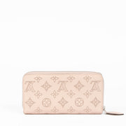 Shop the authentic Louis Vuitton Pink Mahina Zippy Wallet second hand on Labellov.com