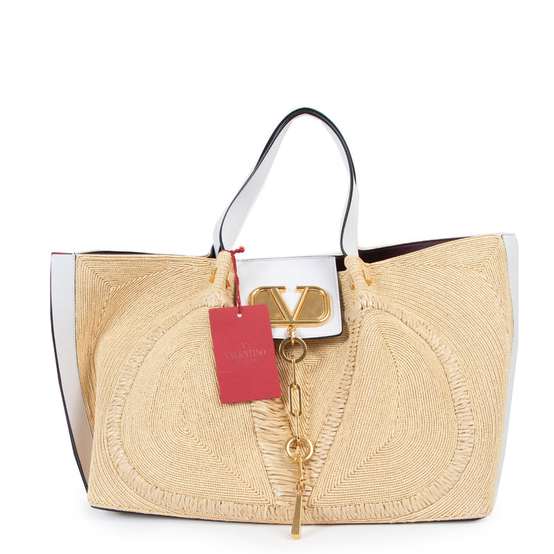 Shop now for your pre-loved, 100% authentic Valentino Garavani Beige Straw Woven Vlogo Tote Bag at Labellov in Antwerp