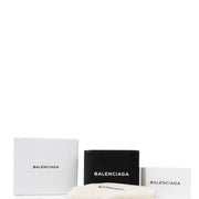 Buy an authentic second hand Balenciaga Black Leather Logo Print Square Folded Wallet in very good condition at Labellov