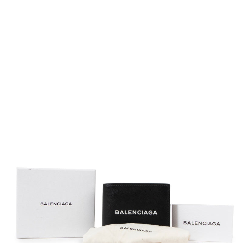 Buy an authentic second hand Balenciaga Black Leather Logo Print Square Folded Wallet in very good condition at Labellov