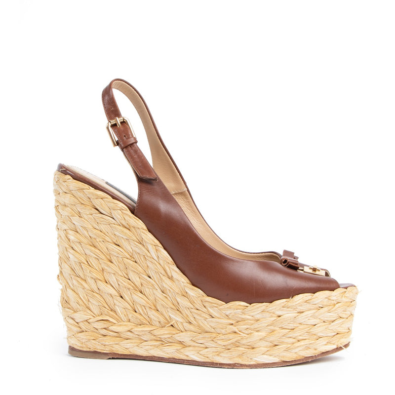 Buy an authentic pair of second hand Dolce & Gabbana Brown Straw Wedges - Size 38 in very good pre-loved condition at Labellov