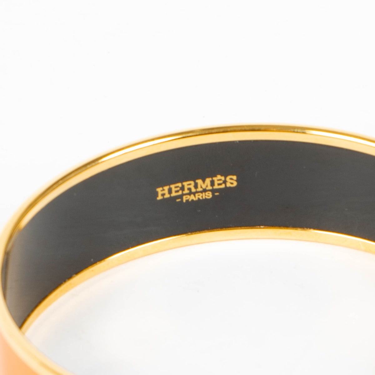 Shop this authentic Hermès Orange Caleche Wide Bangle Bracelet - size 70 pre-loved on Labellov.com