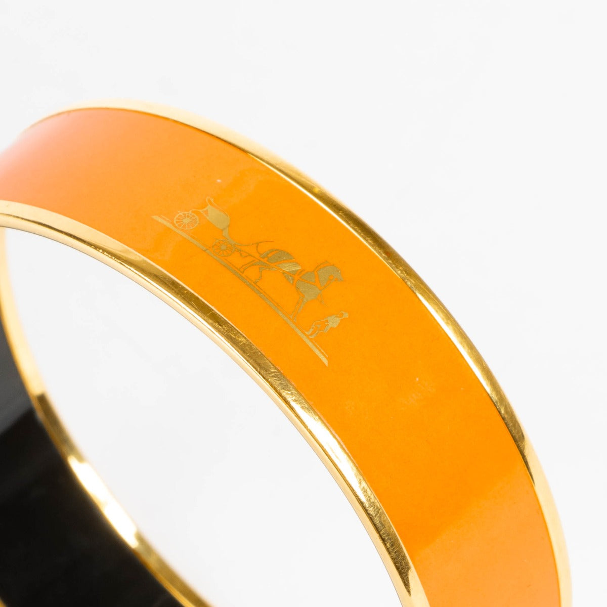 Shop this authentic Hermès Orange Caleche Wide Bangle Bracelet - size 70 pre-loved on Labellov.com