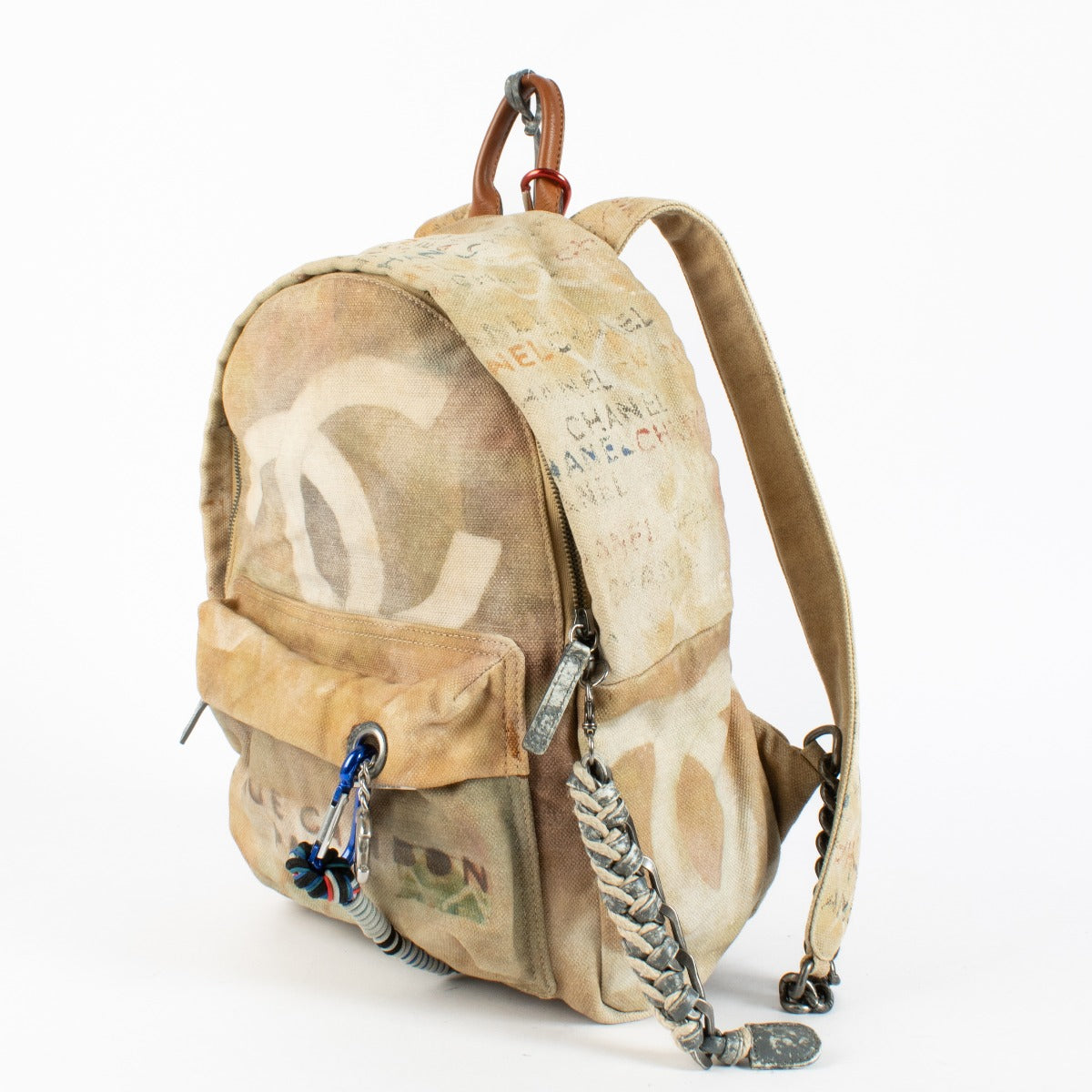 Chanel Beige Graffiti Backpack from 2014 with distressed canvas and rope accents at Labellov.com