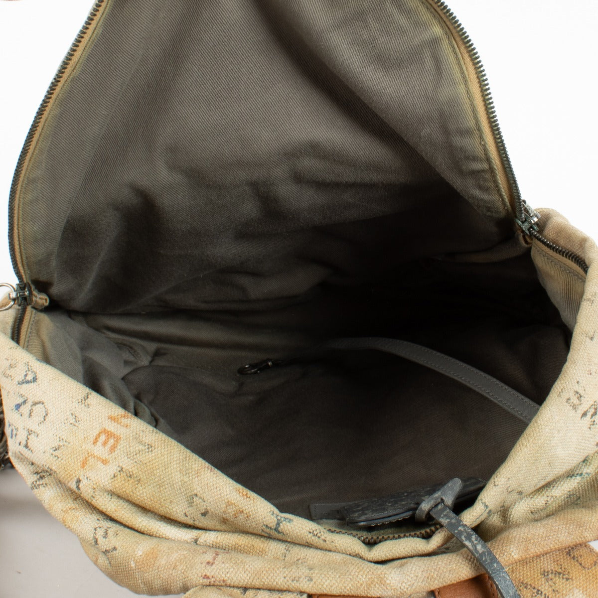 Chanel Beige Graffiti Backpack from 2014 with distressed canvas and rope accents at Labellov.com