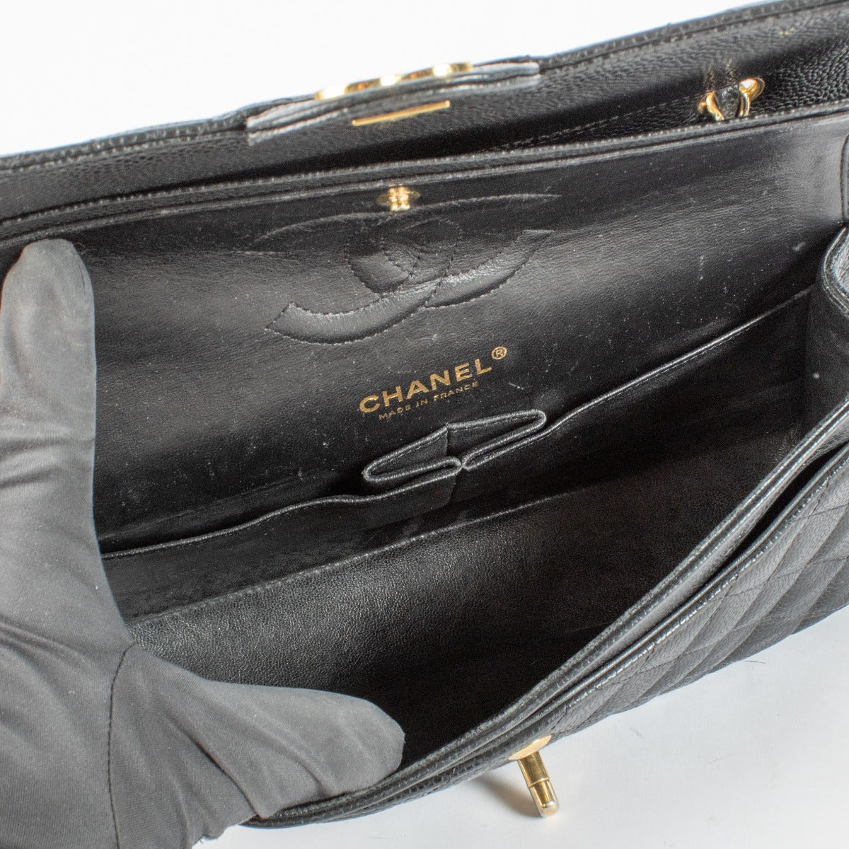 Chanel Black Medium Caviar Classic Flap Bag with gold hardware at Labellov.com