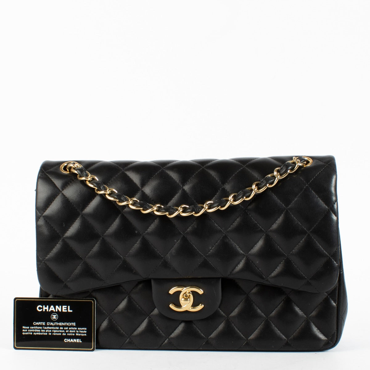 Chanel Black Jumbo Classic Flap Bag in lambskin with gold hardware at Labellov.com