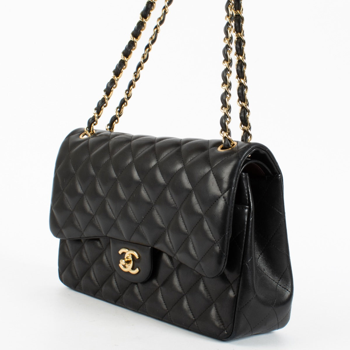 Chanel Black Jumbo Classic Flap Bag in lambskin with gold hardware at Labellov.com