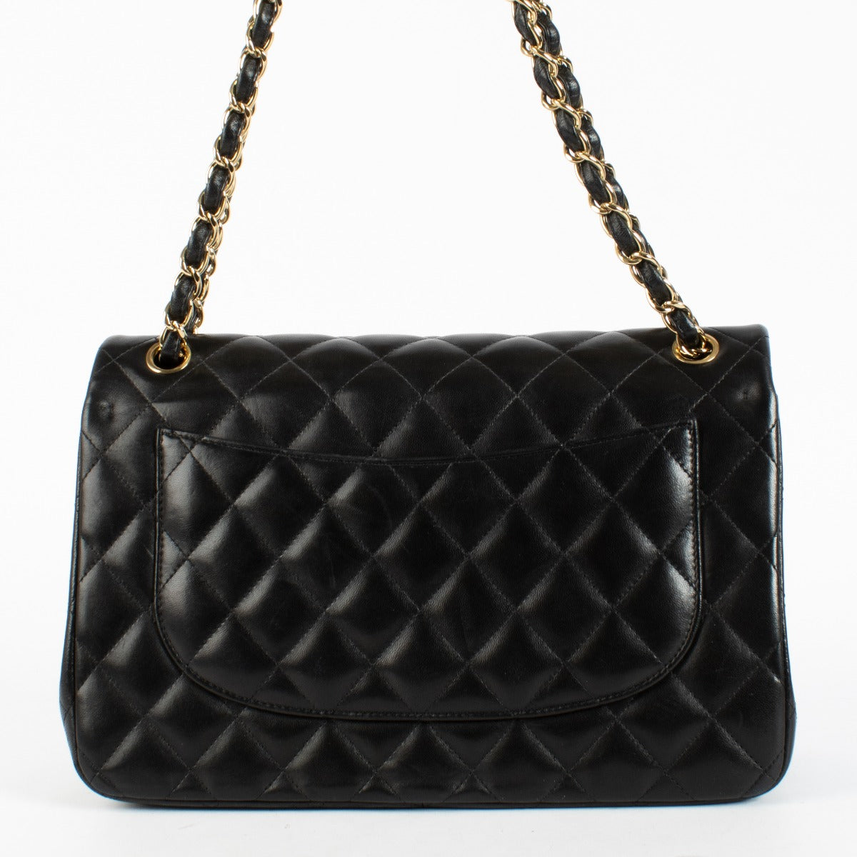 Chanel Black Jumbo Classic Flap Bag in lambskin with gold hardware at Labellov.com