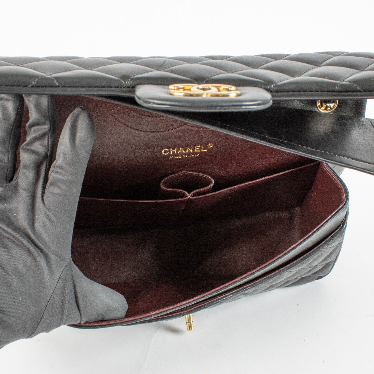 Chanel Black Jumbo Classic Flap Bag in lambskin with gold hardware at Labellov.com