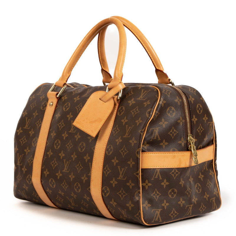 Shop safe online at Labellov in Antwerp, Brussels and Knokke this 100% authentic second hand Louis Vuitton Carryall Compact Travel Bag