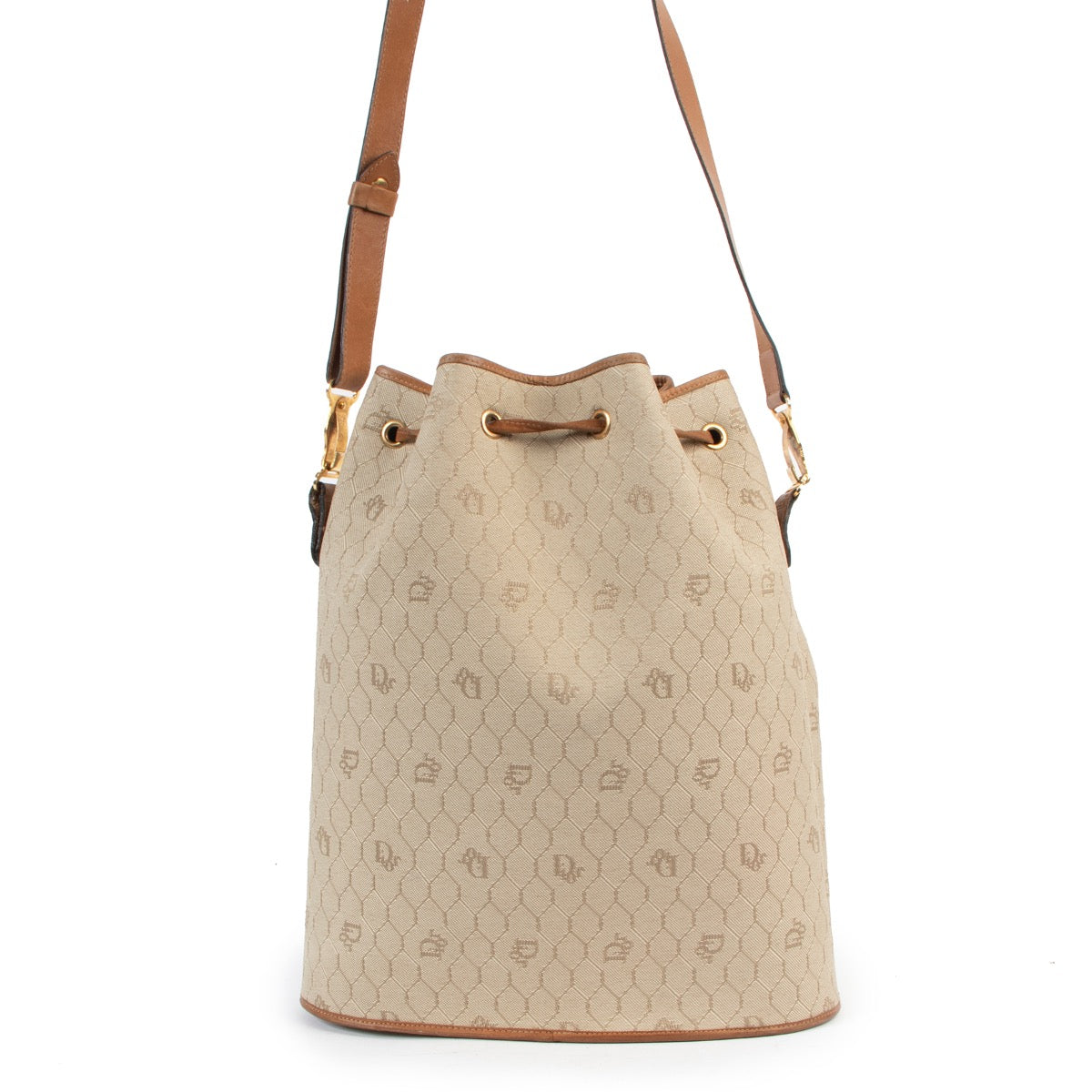 Shop now for your pre-loved, 100% authentic Christian Dior Beige Drawstring Toile Oblique Bucket Bag, at Labellov.