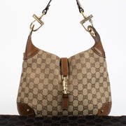 Authentic preloved Gucci GG Canvas Piston Lock Medium Jackie bag on Labellov.com