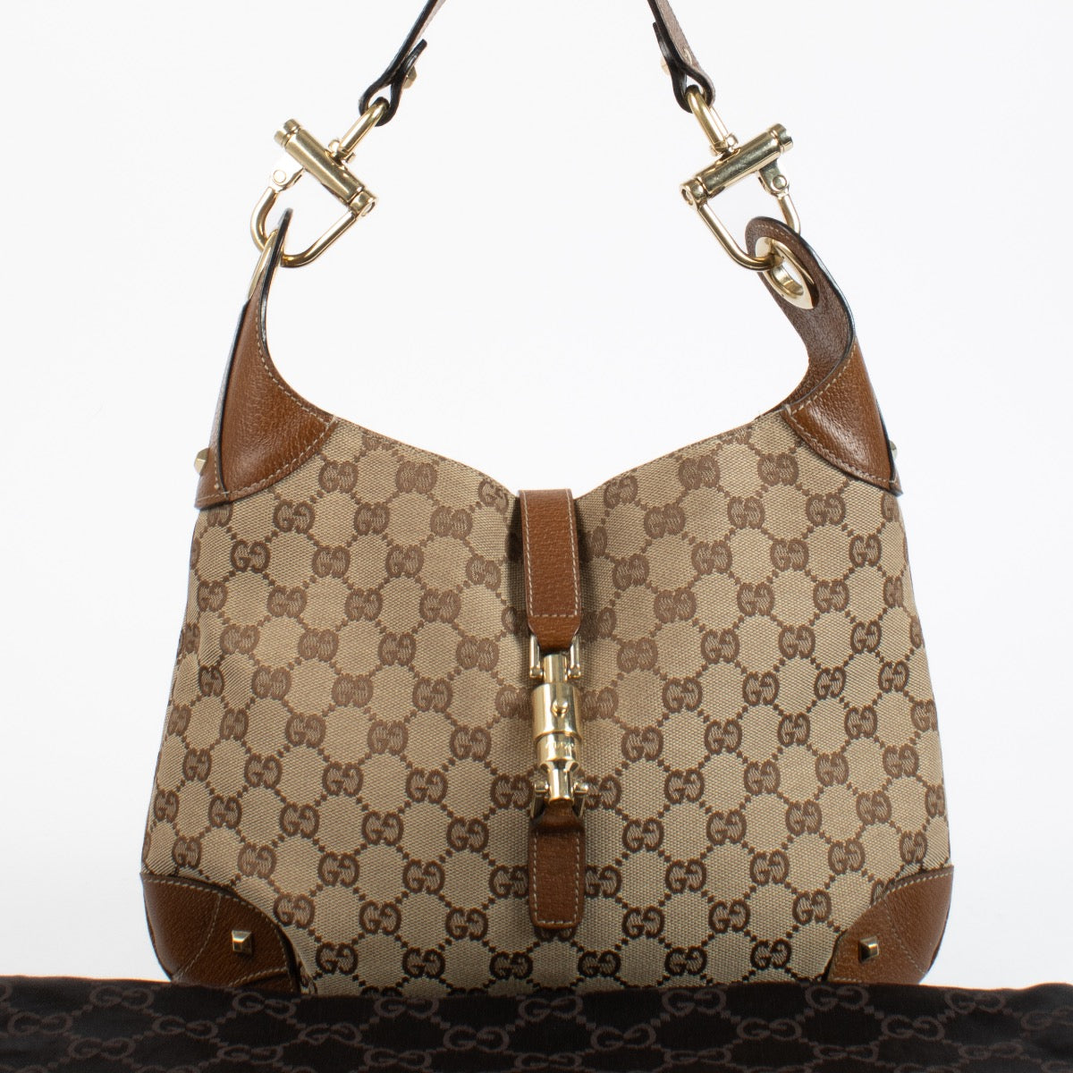 Authentic preloved Gucci GG Canvas Piston Lock Medium Jackie bag on Labellov.com