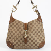 Authentic preloved Gucci GG Canvas Piston Lock Medium Jackie bag on Labellov.com
