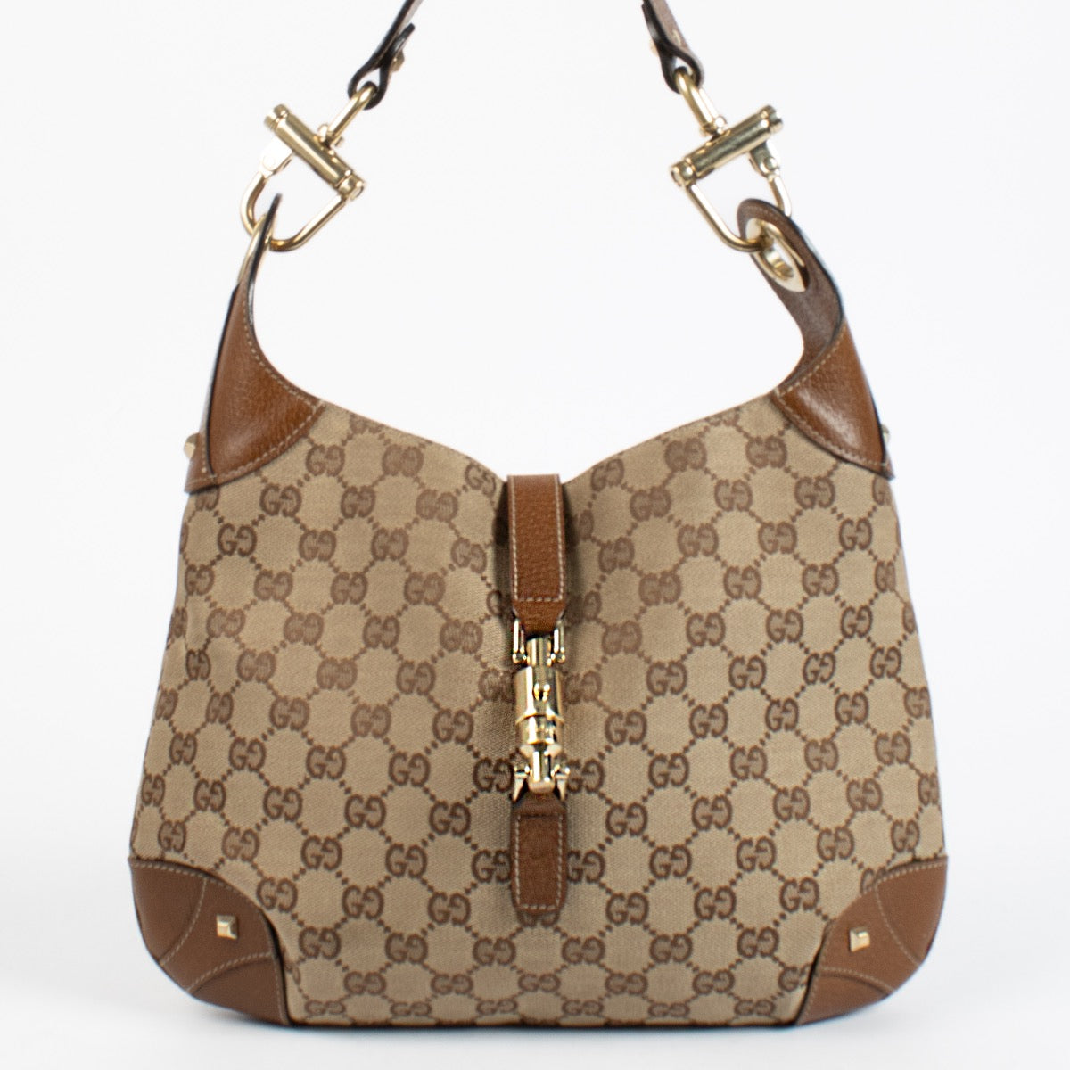 Authentic preloved Gucci GG Canvas Piston Lock Medium Jackie bag on Labellov.com