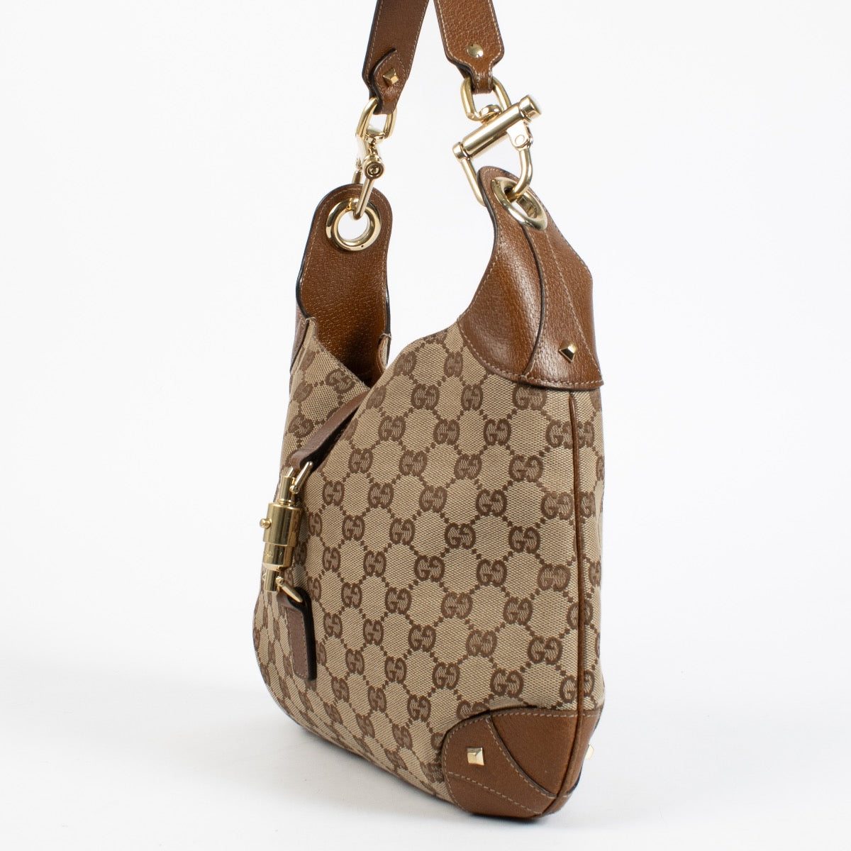 Authentic preloved Gucci GG Canvas Piston Lock Medium Jackie bag on Labellov.com